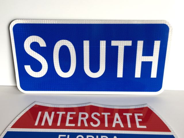 A photo of our South sign paired with an Interstate shield (sold separately).