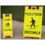 Folding pedestrian crossing signs